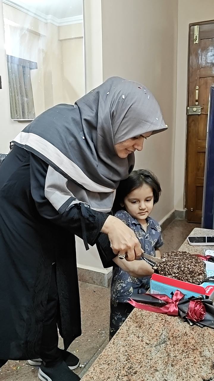 Cutting the cake at the team birthday
