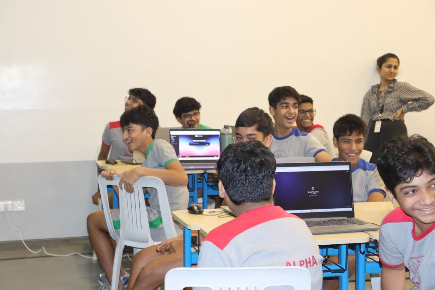 Students giggling at their laptops