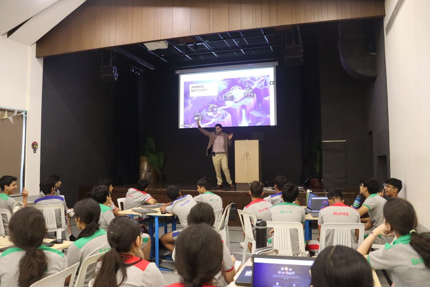Ali on stage with the students at BIS