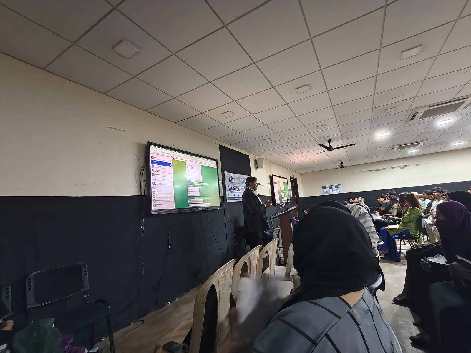 Students watching the demo screens at Burhani College