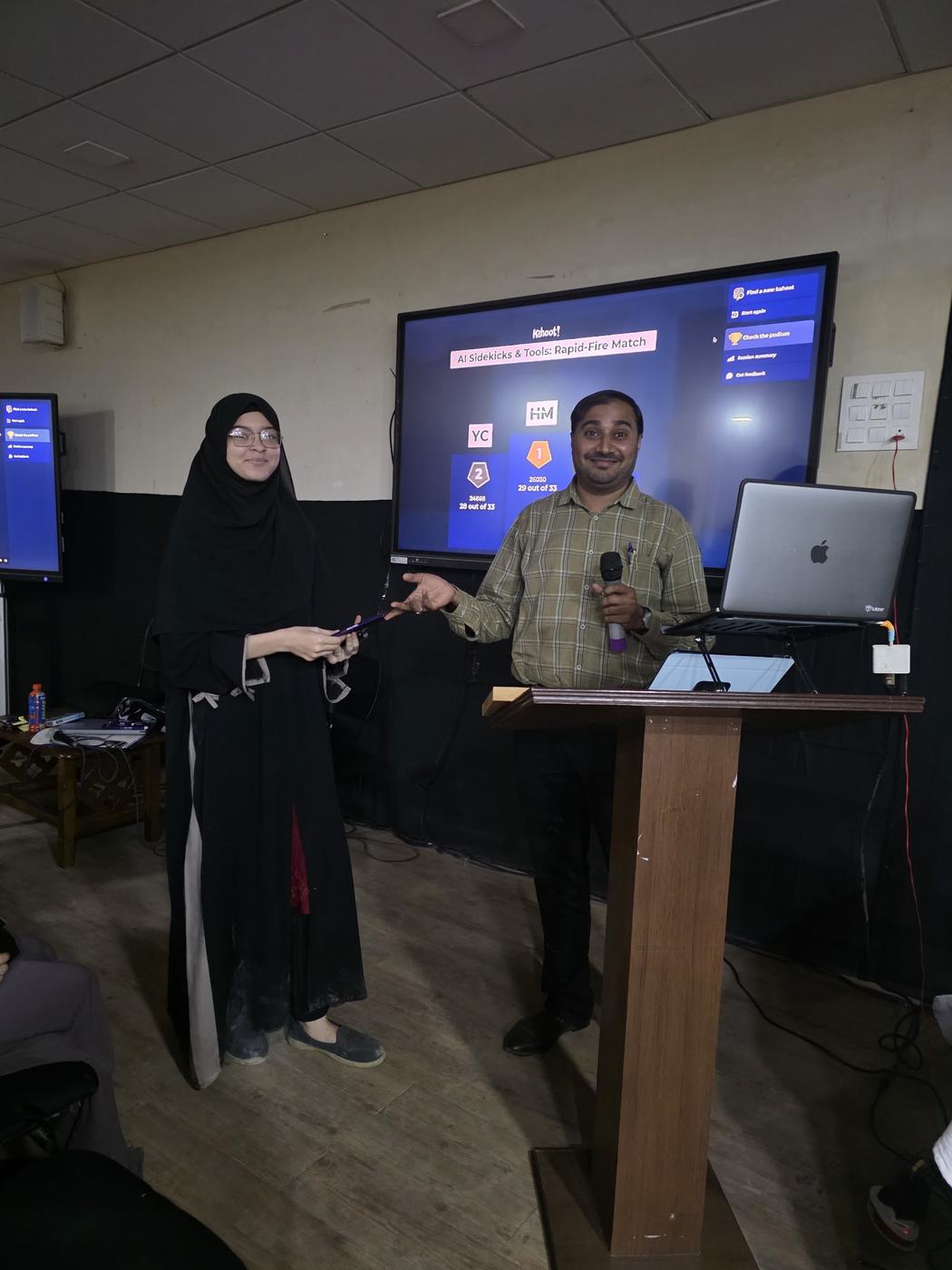 A student receiving her certificate on stage