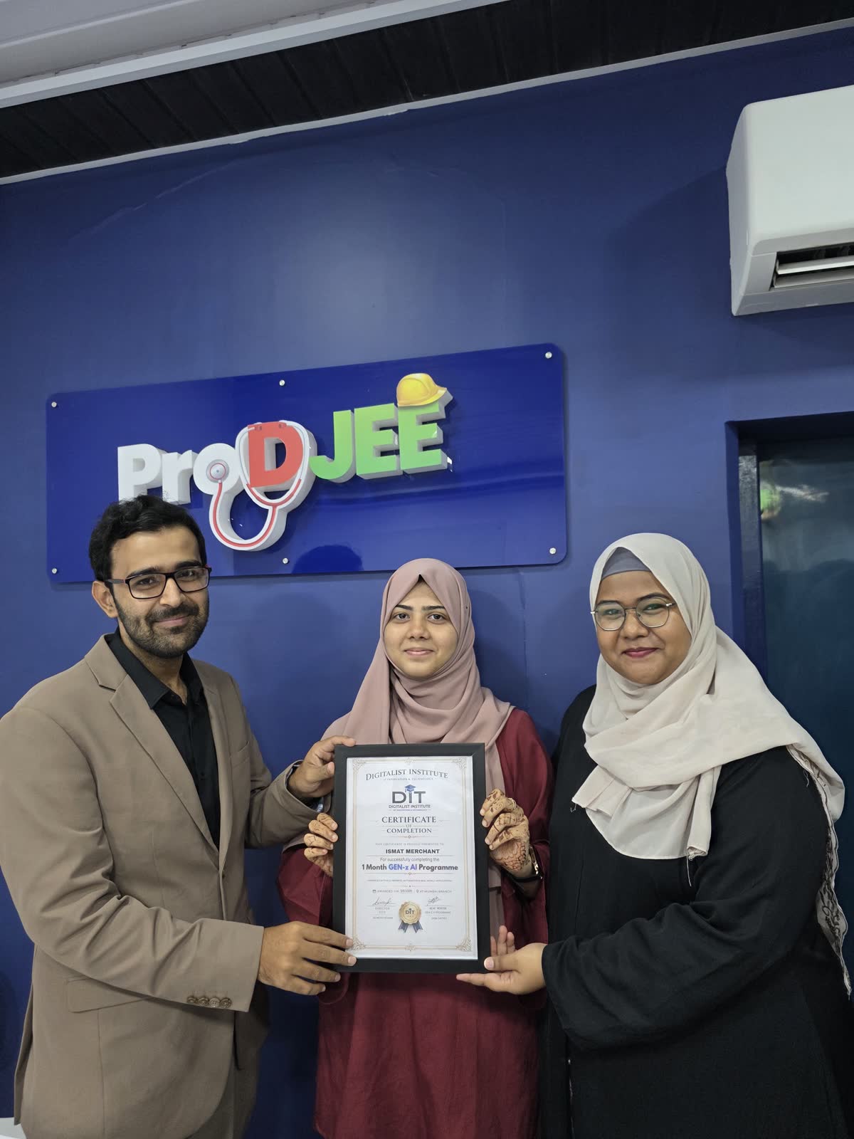 Another graduate with Ali and the programme mentor