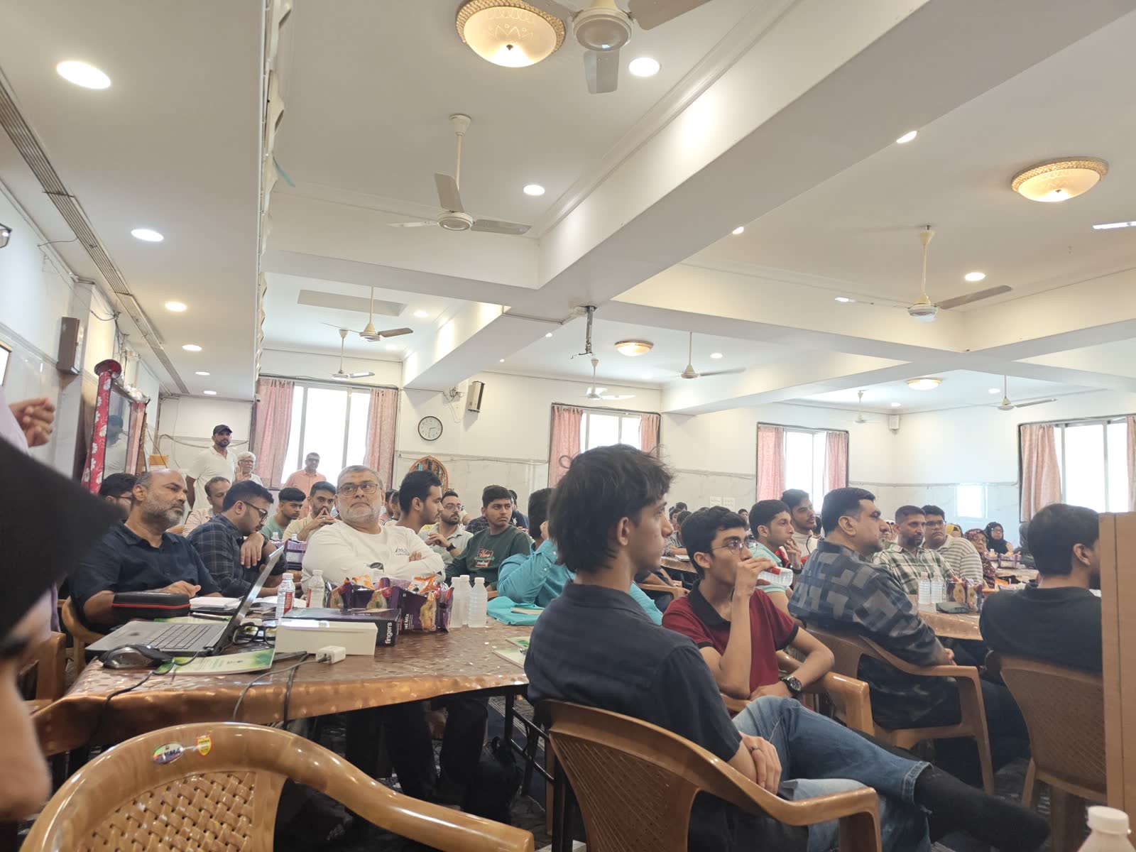Learners at long tables during the Juhu bootcamp