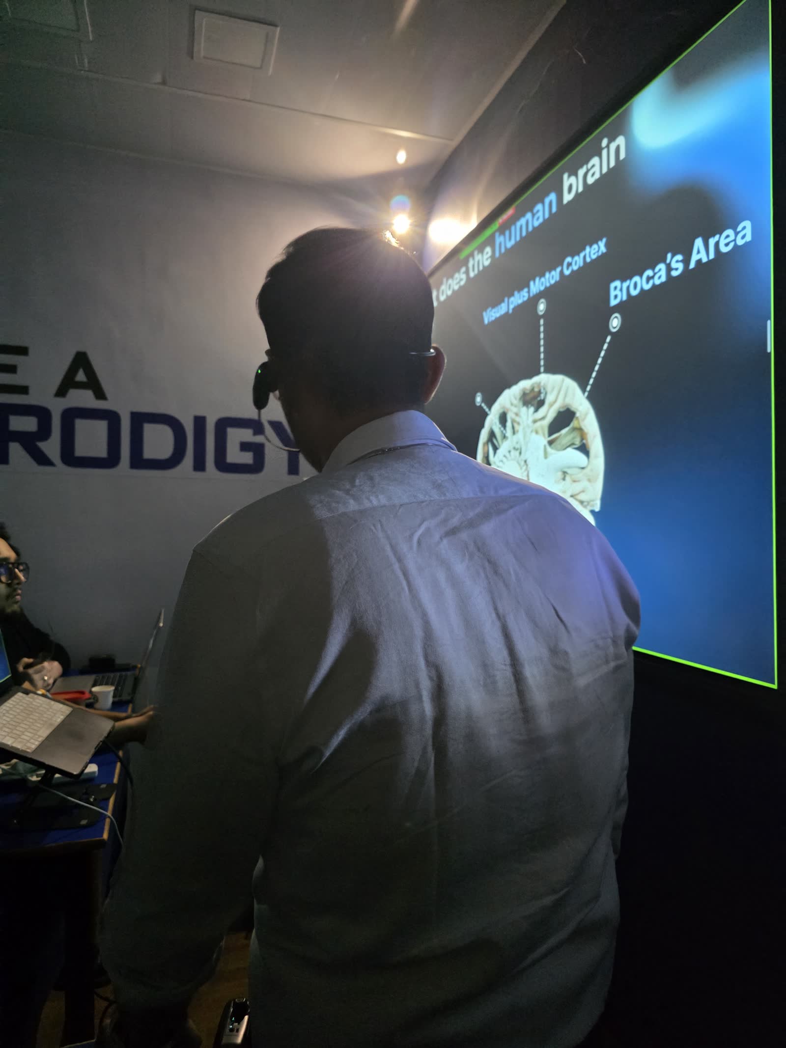 Ali explaining how the brain processes language during a session