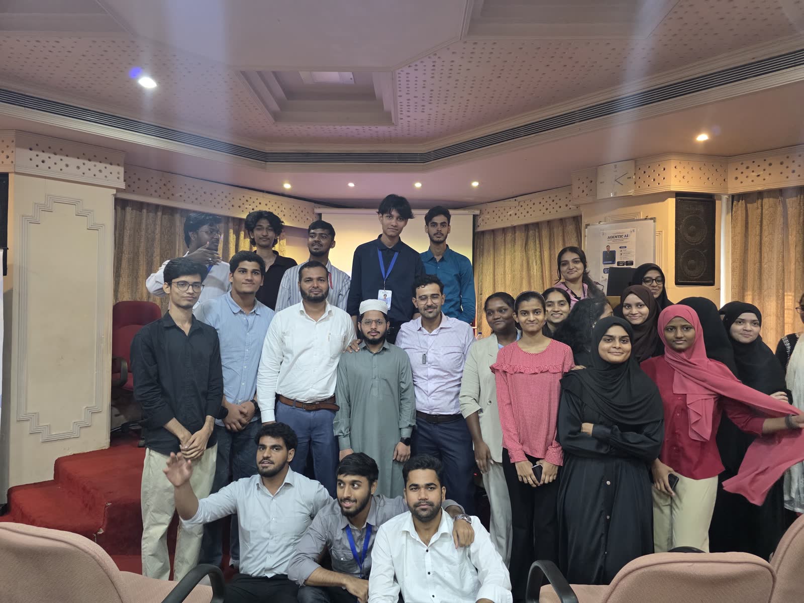 Students and Ali in the auditorium after the session