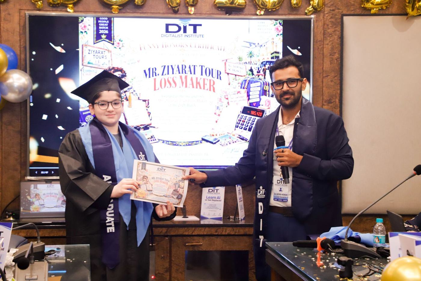 A graduate collecting a funny award