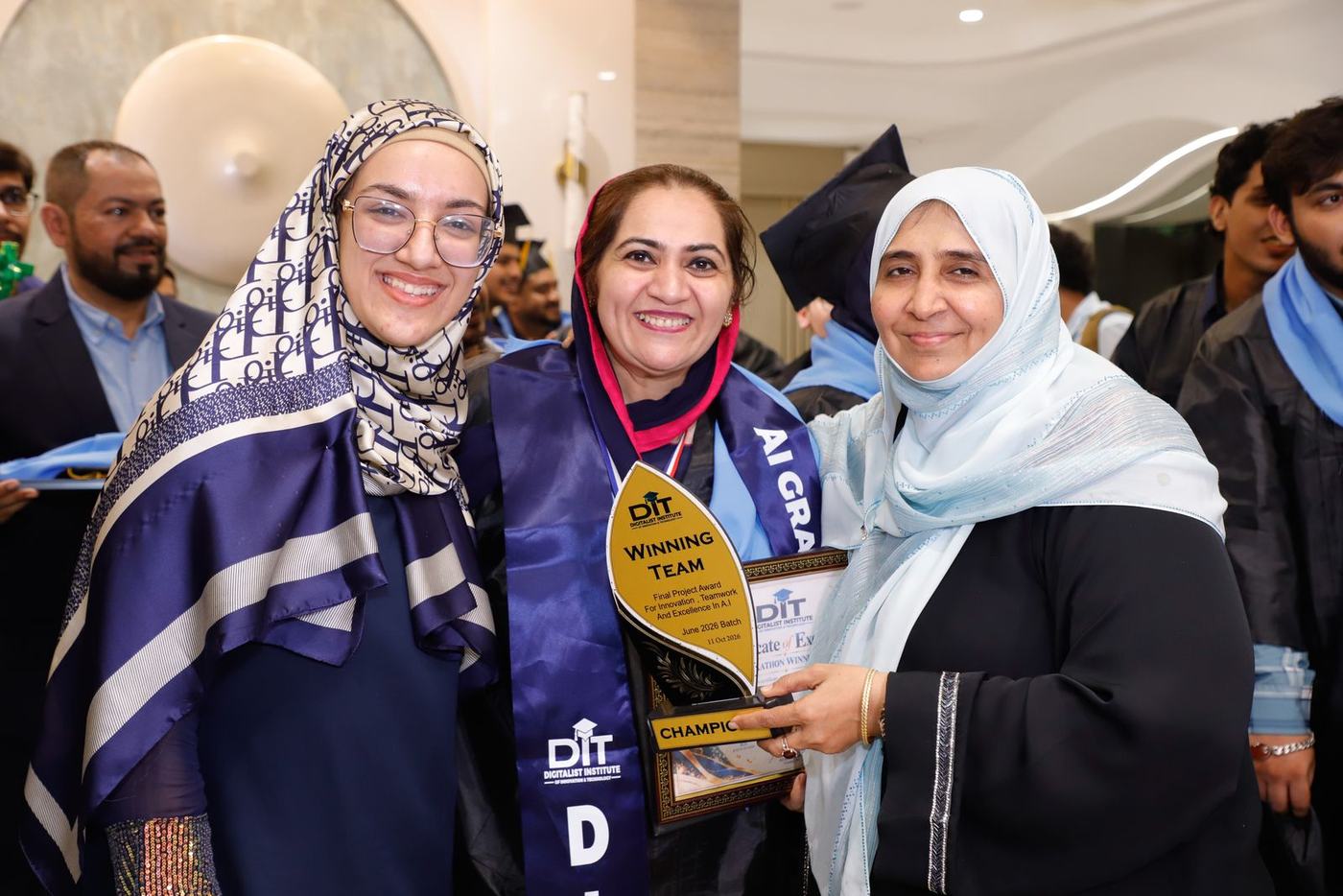 A graduate holding her trophy and certificate