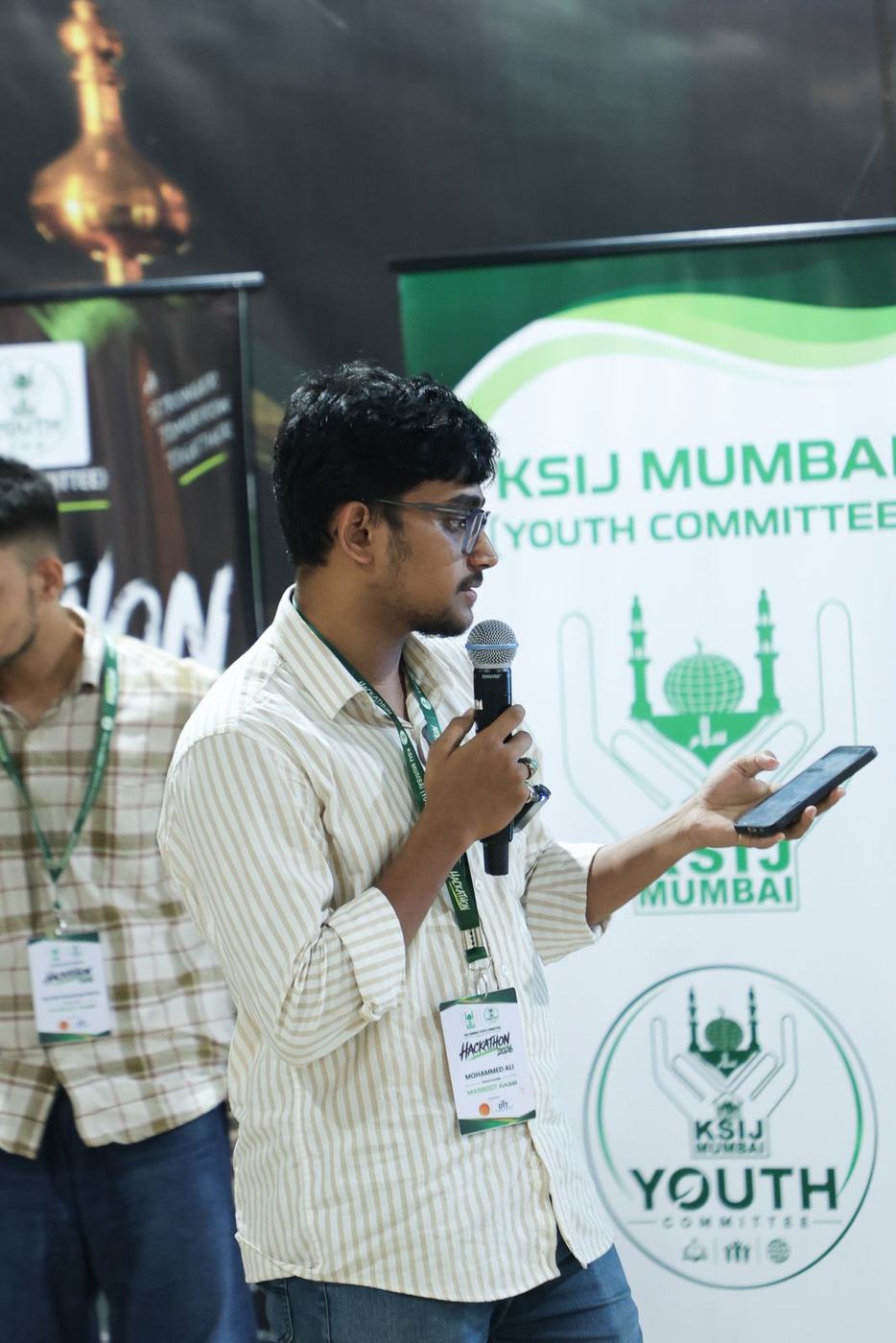 A builder pitching on stage