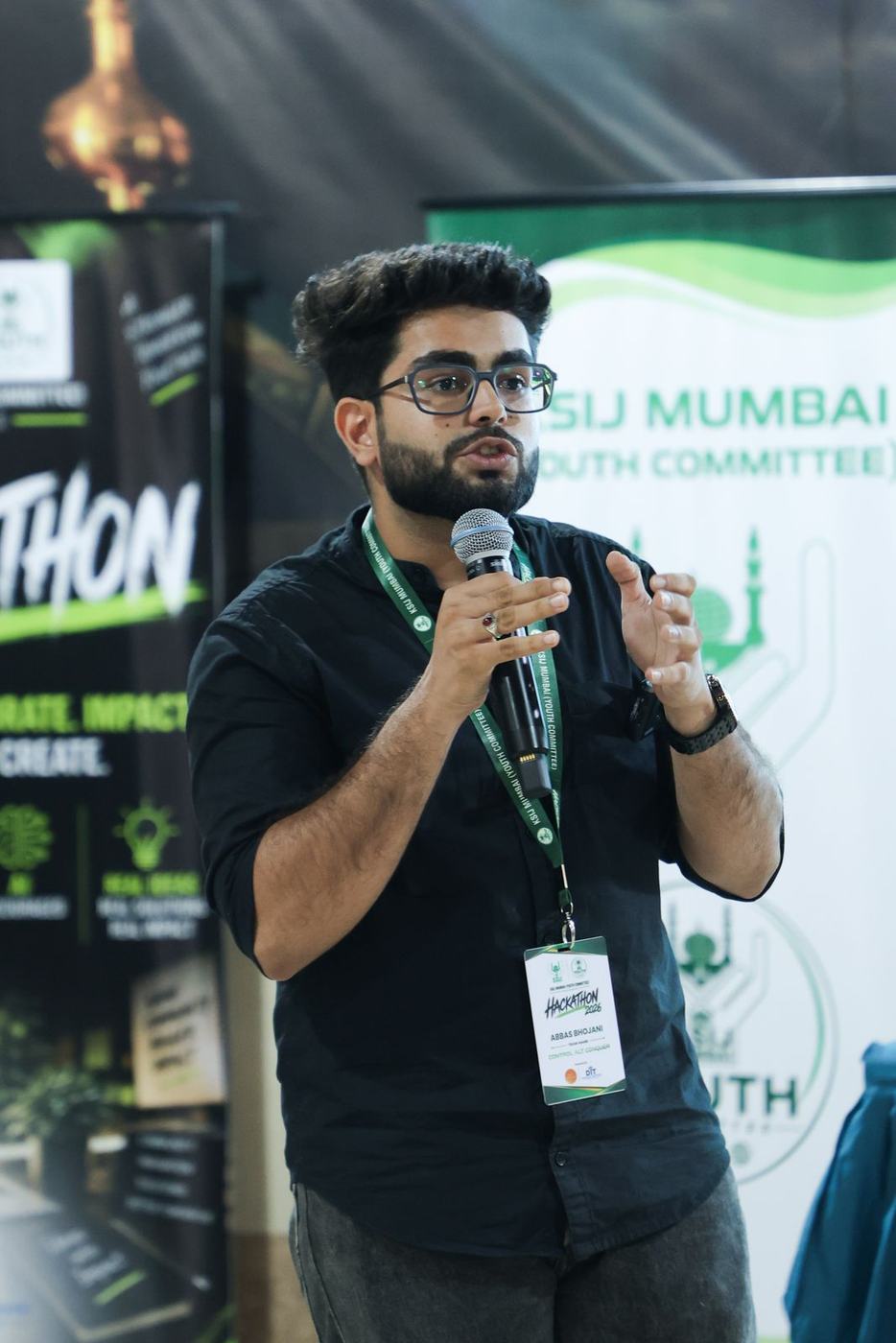 A builder pitching with the mic