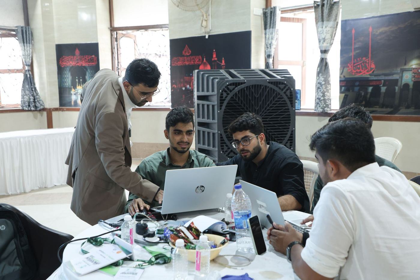 A team around a laptop