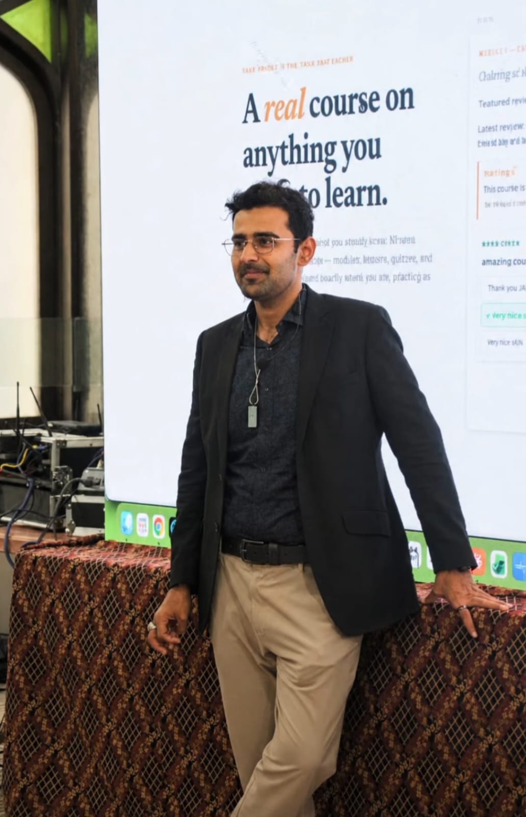 Ali Mehdi Hemani teaching a session with a microphone